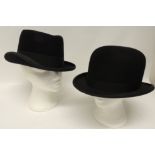 A Dunn & Co gents black bowler hat with brown leather inner band, inner measurements 20cms x 16cms