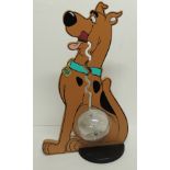 A Scooby Doo money box, the double sided figure with clear plastic collecting sphere in the