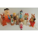 Eleven assorted plastic and rubber figures including Snagglepuss, Scoobydoo, Barney Rubble, Fred