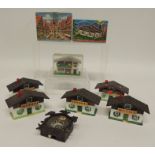 A group of eight plastic novelty chalet "viewers" and a cuckoo clock, two in original printed card