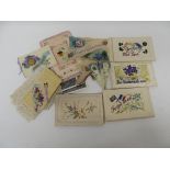 Seventeen WWI embroidered silk postcards, mainly flags and flowers decoration; three WWI embroidered