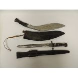 A British bayonet having wood grip and leather covered scabbard with belt loop, blade now rounded,