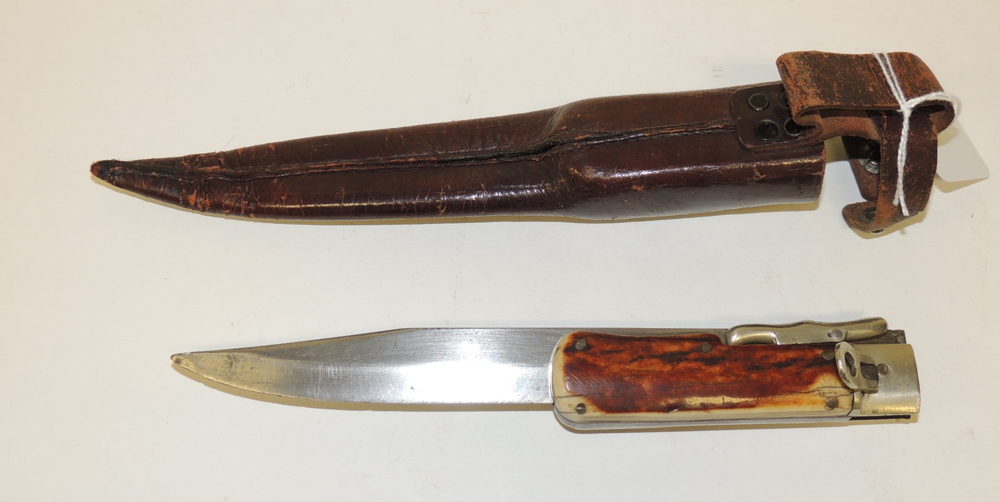 An early 20th Century hunting knife with long single edged folding blade marked "RSC Works" and " - Image 2 of 2