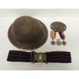 A WWII period metal helmet (lacks liner and chin strap); a RAOC belt with bi-metal buckle; three