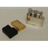 A Dunhill silver plated table lighter together with a Dupont gold metal cigarette lighter (2)