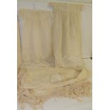 An early 20th Century silk Christening gown of cream net with self silk embroidered decoration to