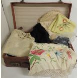 A brown leather suitcase containing a Chinese silk embroidered shawl with tasselled fringe (