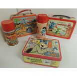 A vintage Flintstones printed metal lunch box with matching thermos flask; another Cartoon Zoo lunch