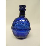 A Harden Star blue glass hand grenade extinguisher, sealed, 18cms high