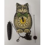 An early 20th Century German made novelty wall clock in the form of a seated cat with printed