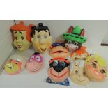 Ten colourful plasatic face masks of Hanna Barbera characters including Fred Flintstone, Bamm-