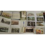 A quantity of assorted postcards in albums and loose including Whitbread beer mat type cards