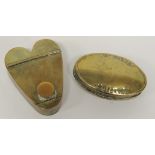 An oval brass snuff box stamped "W Allen Ruishton" 8cms wide and together with a simply made brass