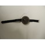 A WWII German Luftwaffe wrist compass with black dial, marked on the back AK39 10146549 F1 23235 and