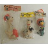 A c.1960's Dell Fireman Huck "Squeeze" toy in original bag with label; another Huckleberry Hound