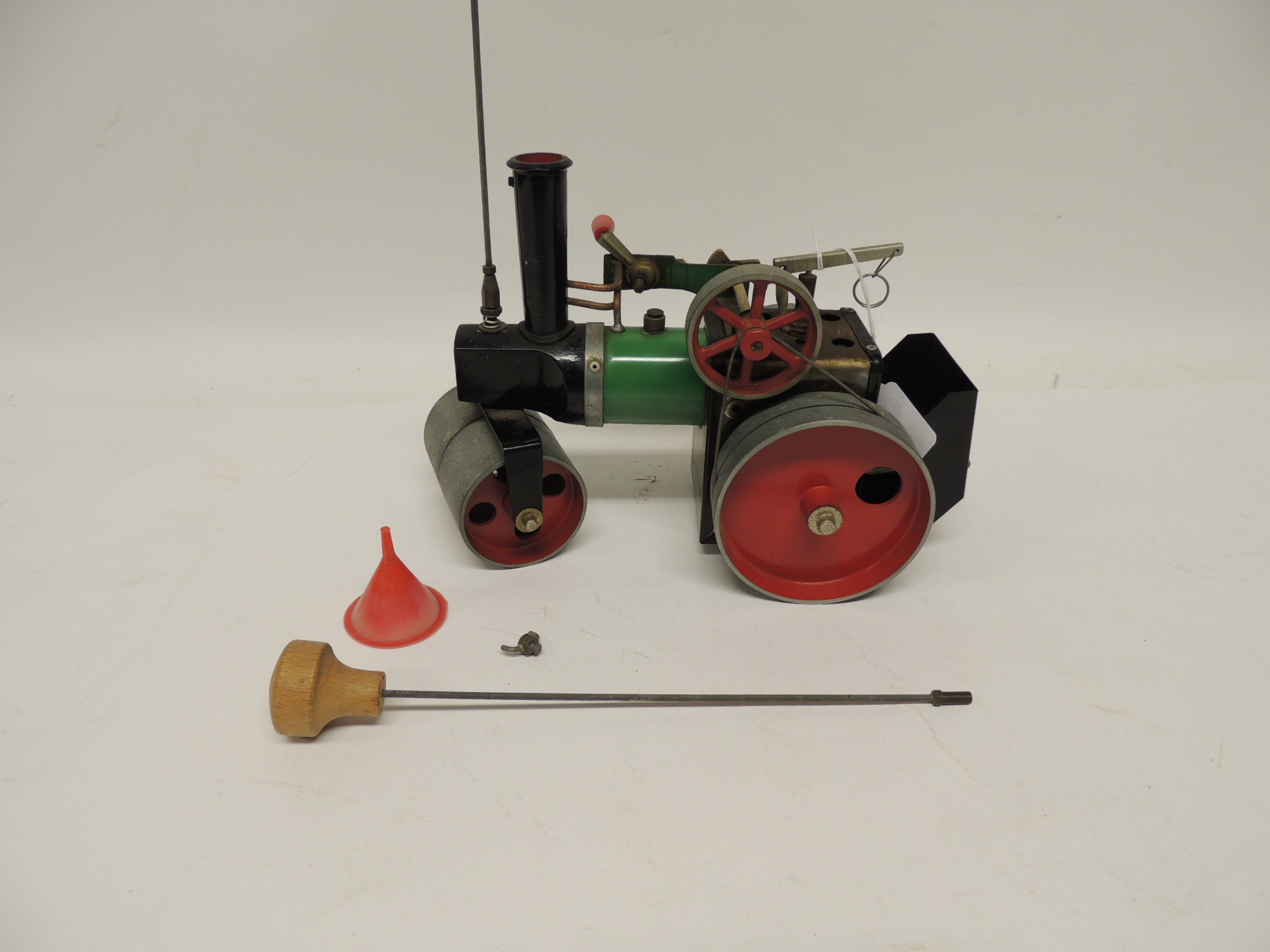 A Mamod live steam road roller, unboxed, with steering rod, funnel and burner