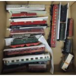 A quantity of unboxed East German railway electric and diesel locos; coaches and wagons ++mixed