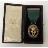 Volunteer Officer's Decoration, oval skeletal with crowned VR, on green ribbon and in original