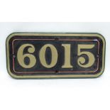 A heavy replica GWR steam locomotive plate number 6015, painted brass (originally number for King