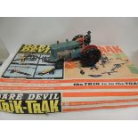 A battery operated plastic tractor with driver together with Dare Devil Trik Track in original