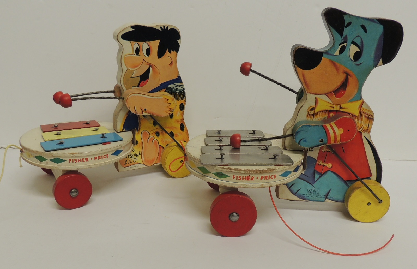 Two Fisher Price pull along "Zilo" toys - Huckleberry Hound and Fred Flintstone, 20cms high (2)