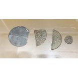 Two early cut coins; a very small early coin and another (4)