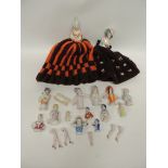 A collection of 12 German porcelain half dolls, various styles and sizes including woman holding a