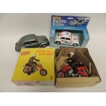 A Japanese made clockwork Dax Honda motorcycle and rider in original box; A Japanese made tinplate