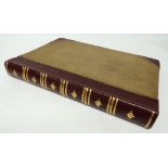 A large late 19th Century leather bound album containing black and white photographic images of