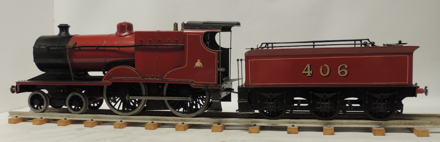 A 3.5" GAUGE LIVE STEAM LOCOMOTIVE AND TENDER the Midland 4-4-0 loco with six wheeled tender