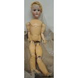 An Armand Marseille bisque socket head doll impressed "Armand Marseille Germany 390 A8M" with