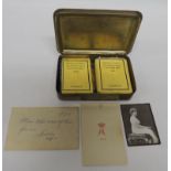 A WWI Princess Mary Christmas tin complete with original packets of cigarettes and tobacco, photo of