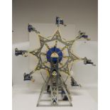 A Meccano mechanical display model of a fairground Big Wheel, having seats suspended from a