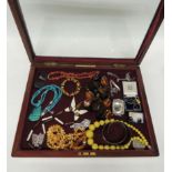 A Mappin & Bros mahogany glass topped counter top display box containing a selection of jewellery