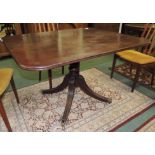 A 19th century rectangular mahogany tilt top breakfast table on turned pillar supports and four