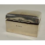 An Edwardian silver cigarette box having hinged domed cover, Birmingham 1909, 5.5cms high