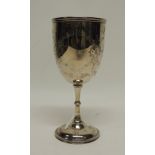 A Victorian silver goblet with engraved decoration, on slender knopped stem and circular slightly