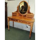 A Victorian satinwood Duchess style dressing table, having oval mirror, jewellery drawers, two