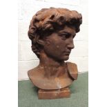 A large, heavy cast iron bust of the head of David after Michaelangelo, approx 65cms high