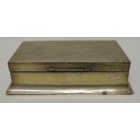 A rectangular silver cigarette box with presentation inscription to the lid, Sheffield 1937, 20cms