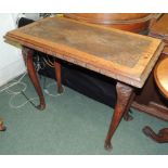 A Victorian rectangular carved oak centre table, the top with deeply carved foliate detail, on