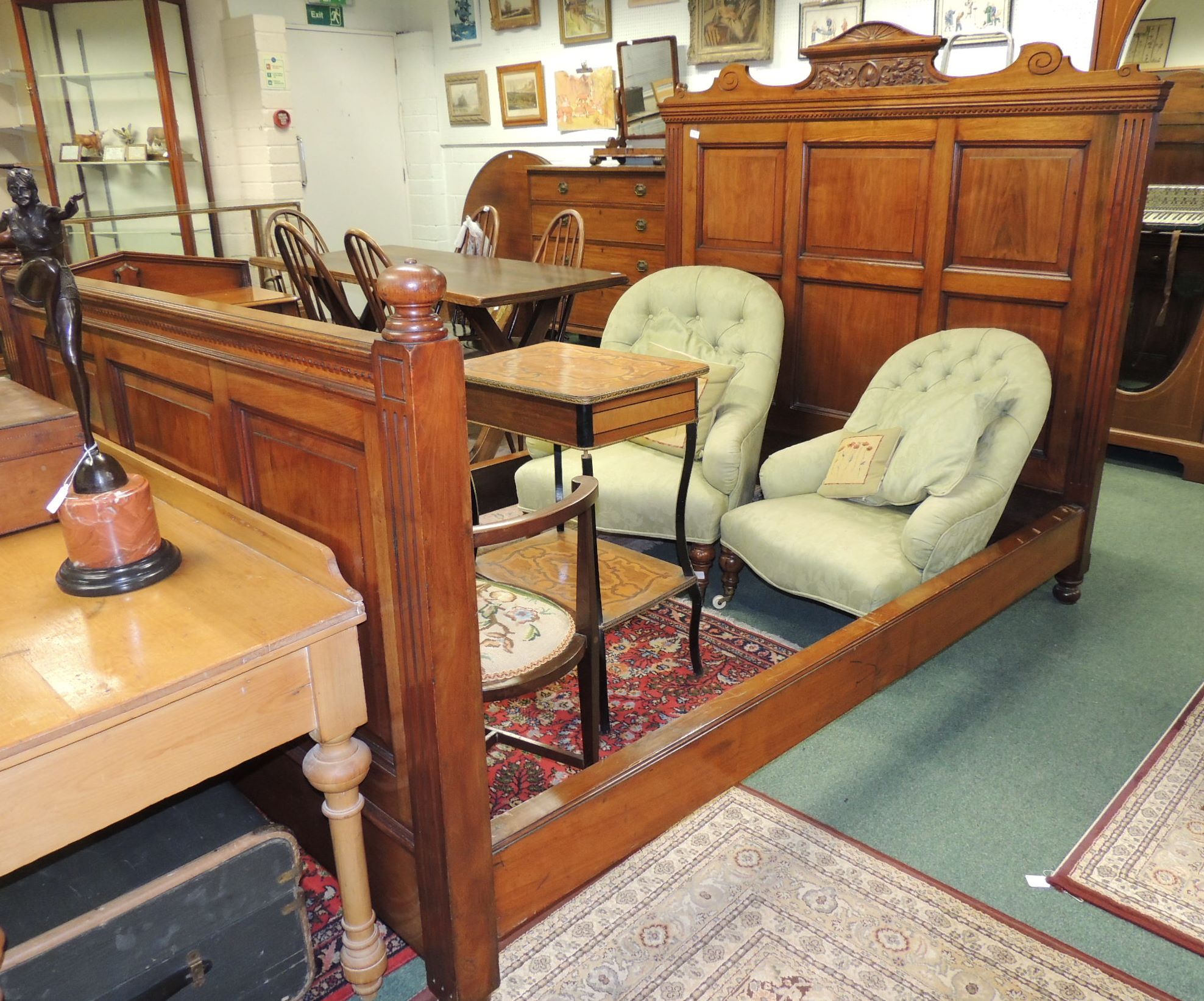 A good quality late Victorian walnut double bed, having panelled solid head and foot board; the