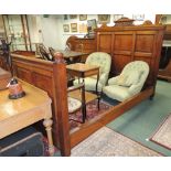 A good quality late Victorian walnut double bed, having panelled solid head and foot board; the