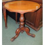A Victorian mahogany pedestal table, the circular top on baluster turned pedestal and scrolling