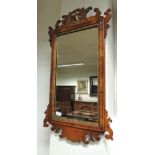 A 19th century walnut framed Swansea type wall mirror, with eagle and openwork top, 84cm x 48.5cm.