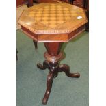 A Victorian inlaid walnut octagonal games/work table, the top with decoratively inlaid chequer