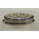 A small Victorian silver snuff box of navette shape, the hinged lid embossed with angel masks,