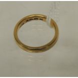 A 22ct gold wedding band, 7.6g