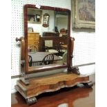 A Victorian mahogany swing dressing mirror, on shaped base, 59.5cm wide.