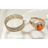 A 9K gold ring, set with a cabochon amber coloured stone, size O; and another 9ct white and yellow